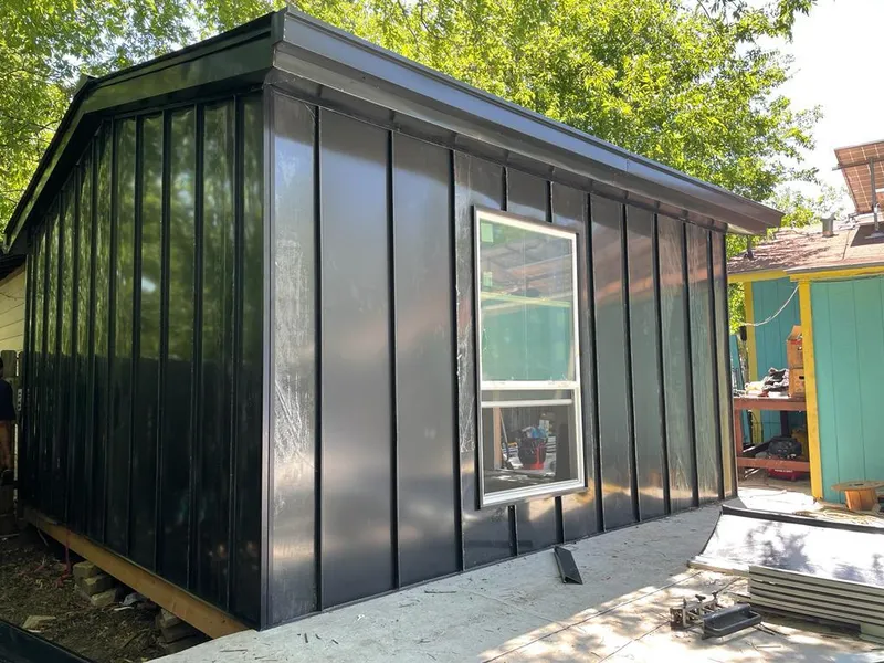 Black standing seam metal wall panels for Roof Inspection in Castle Shannon